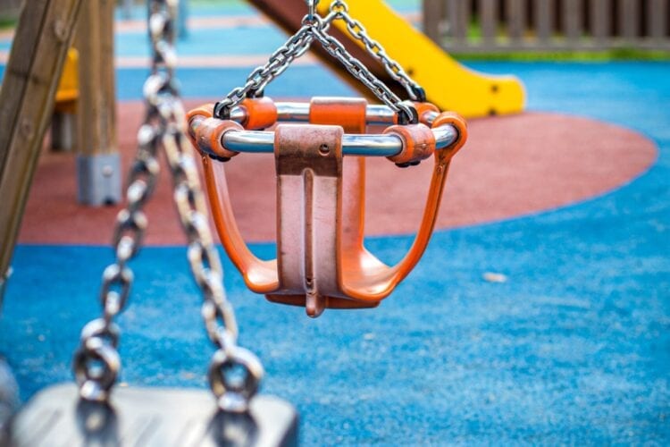 brown and black swing on blue and brown ground