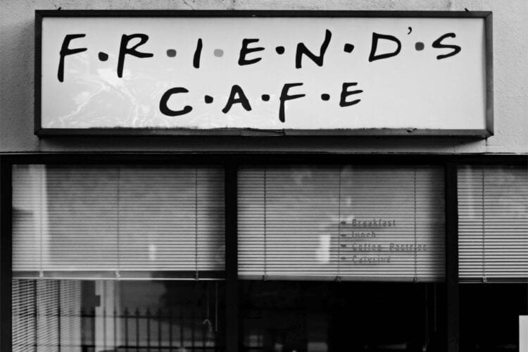 gray scale photo of Friends Cafe store