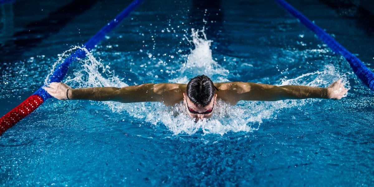 man doing butterfly stroke