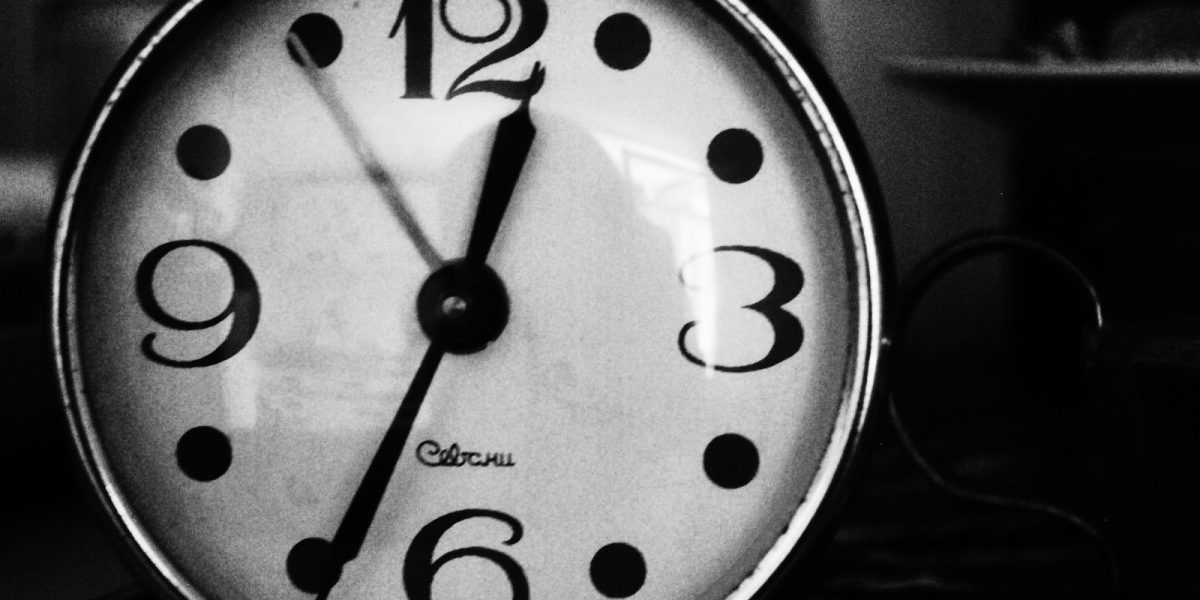 grayscale photo of analog clock