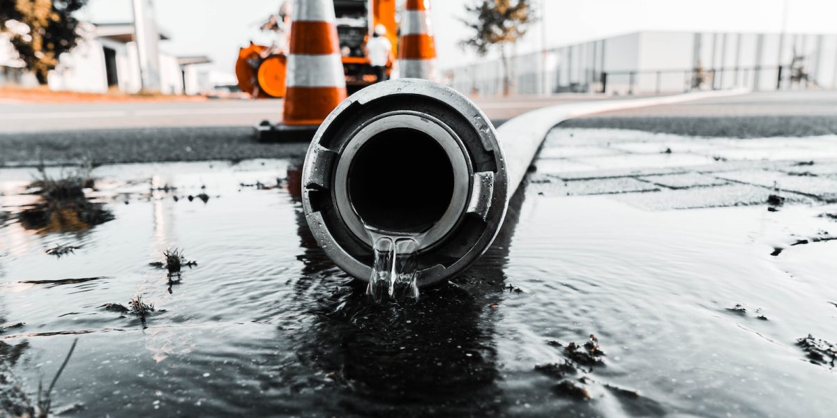 water coming out from gray pipe